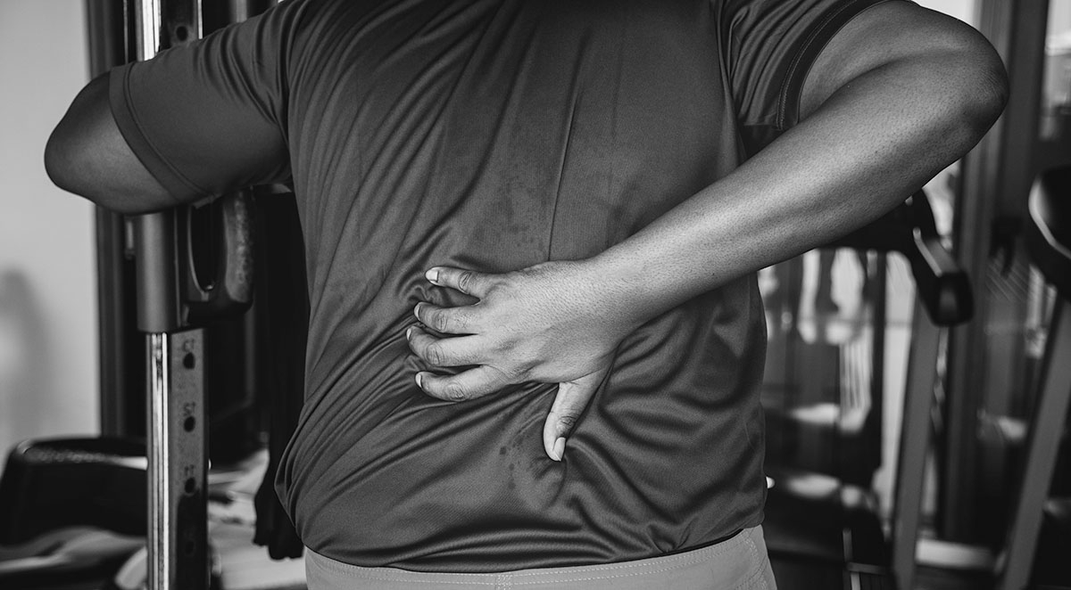 man having problems with his back
